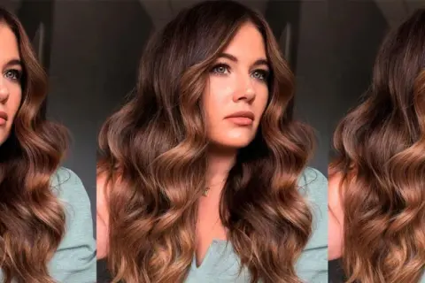 Mujer con ondulado pelo marrón caramelo, con reflejos dorados que iluminan su rostro.
